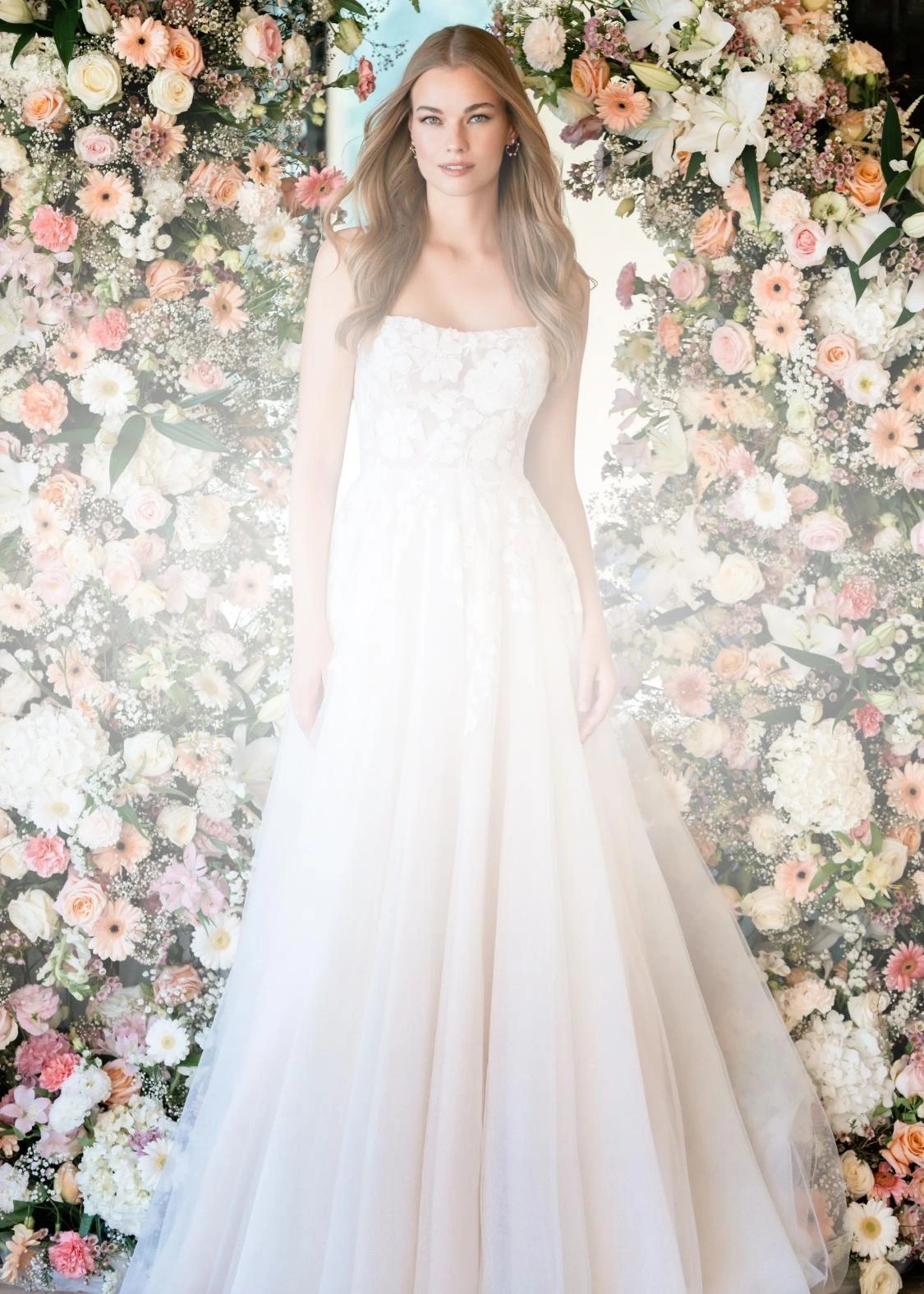 Photos of model wearing romantic style bridal gowns